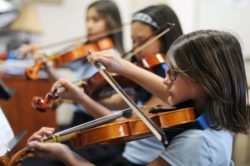 Girls playing the violin